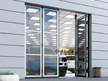 Складные панорамные ворота предназначены для перекрытия проемов в зданиях с остекленными фасадами, например, в автомобильных салонах